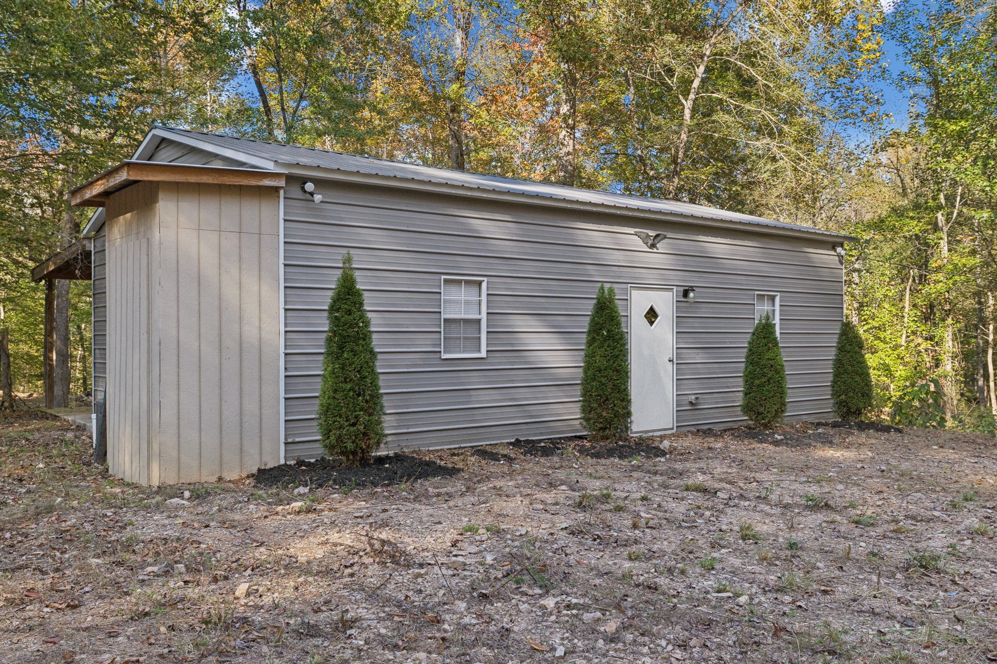 1399 Roberts Creek Road Waverly, TN 37185 - Photo 2 of 42 a view of a house with a small yard and large tree