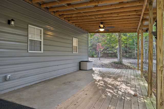 a view of a porch with wooden floor
