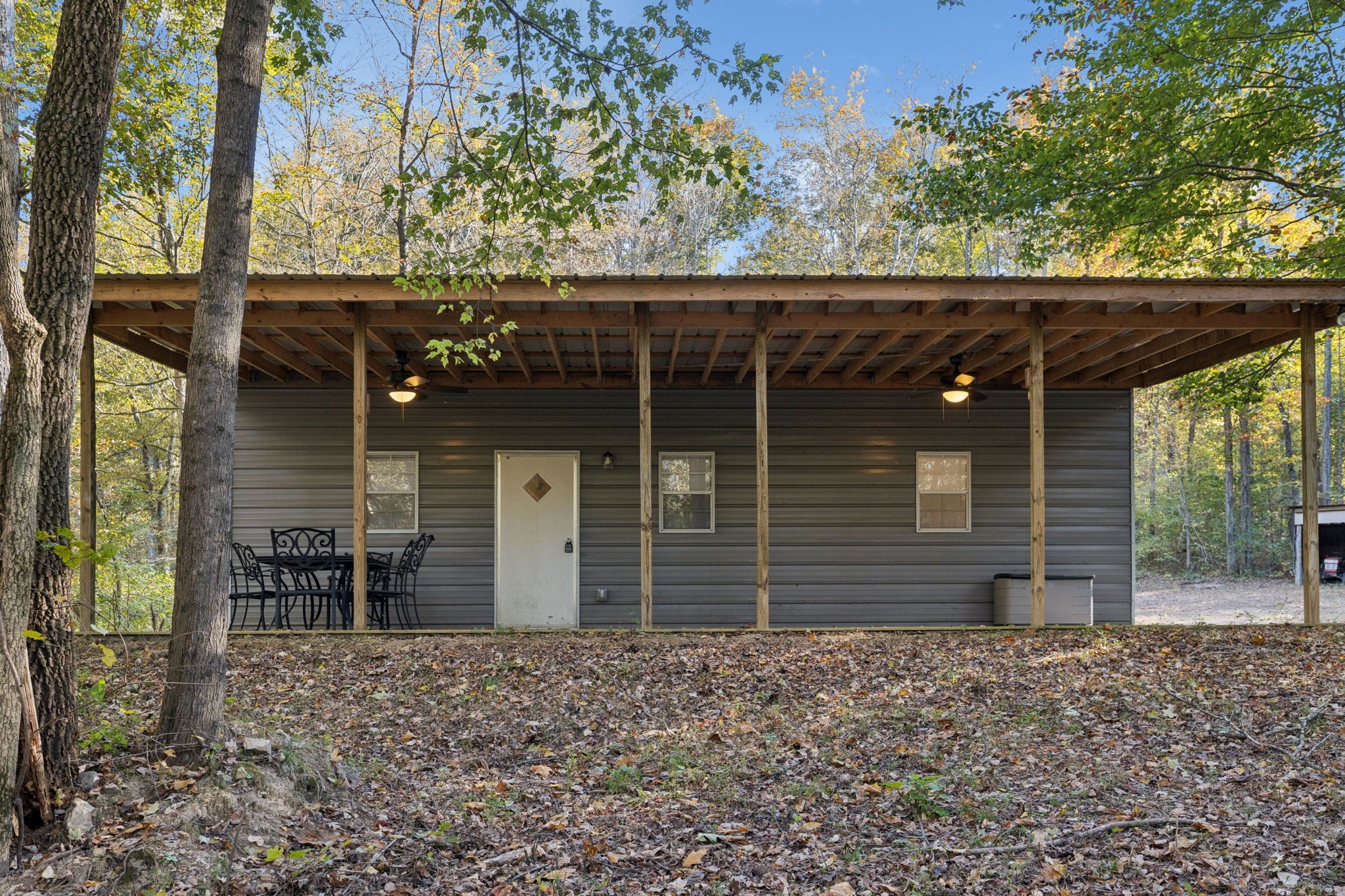 1399 Roberts Creek Road Waverly, TN 37185 - Photo 24 of 42 a front view of a house with garden