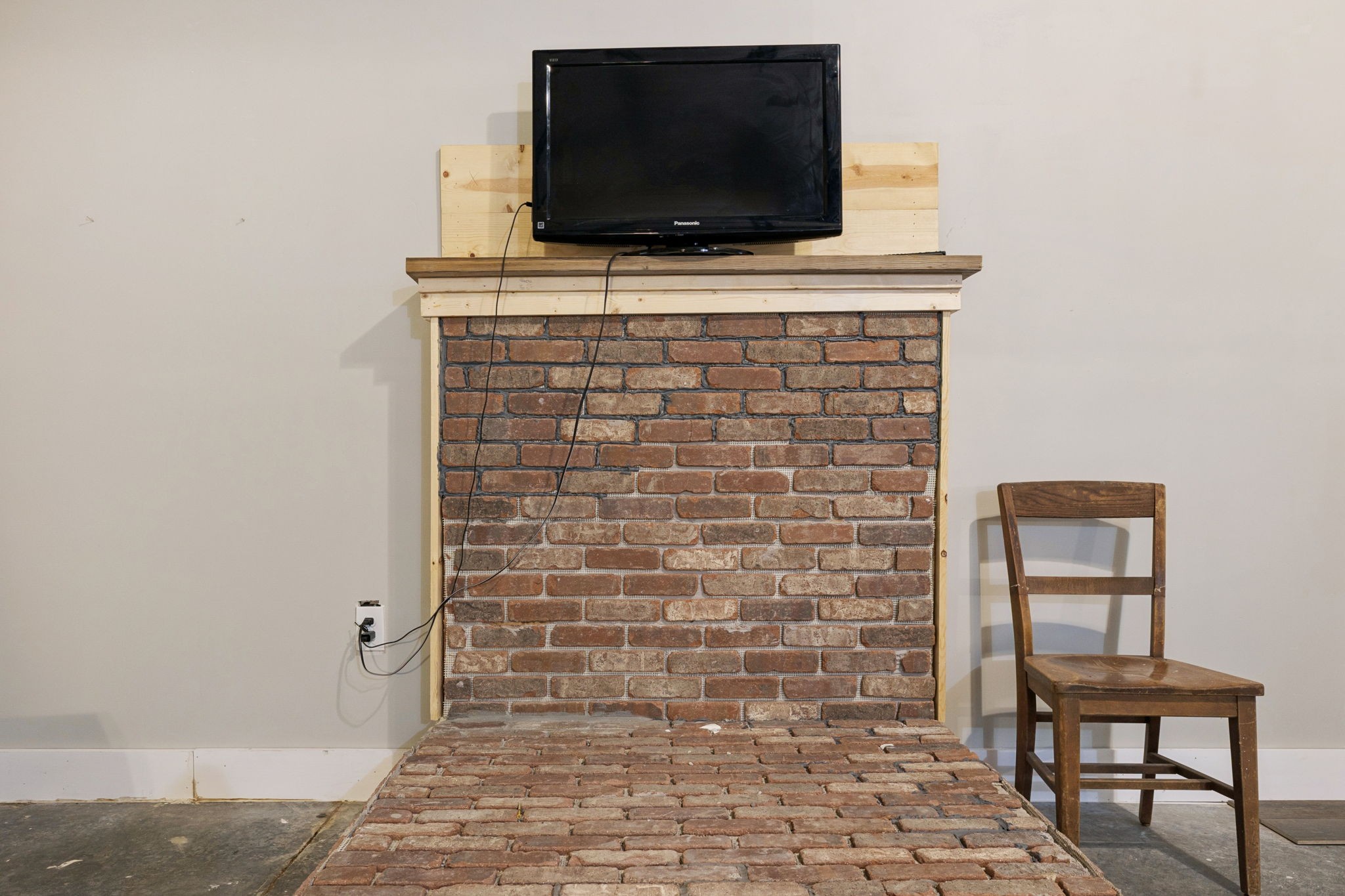 1399 Roberts Creek Road Waverly, TN 37185 - Photo 8 of 42 a living room with a flat screen tv and a fireplace