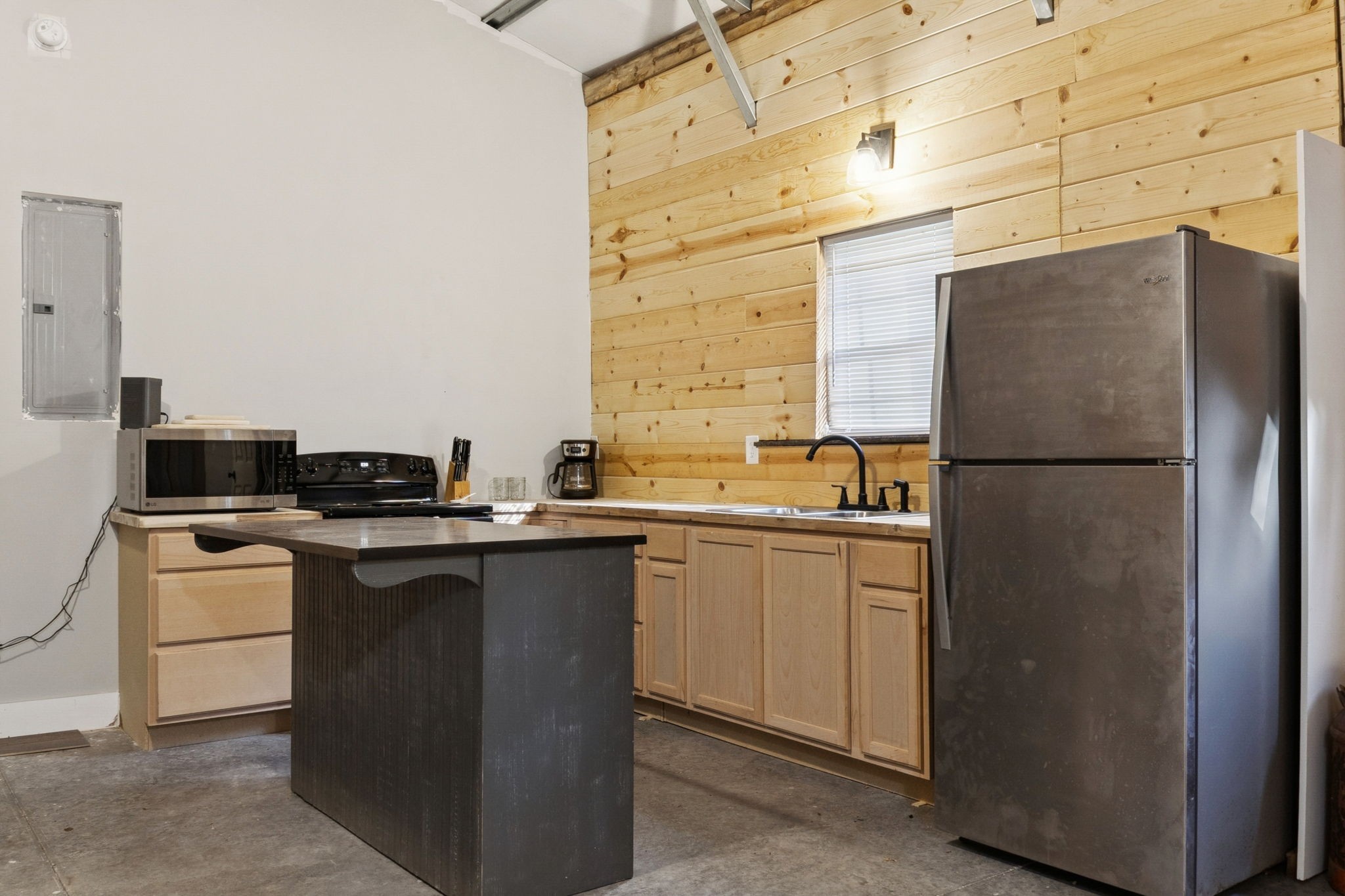 1399 Roberts Creek Road Waverly, TN 37185 - Photo 10 of 42 a kitchen with a sink and a refrigerator