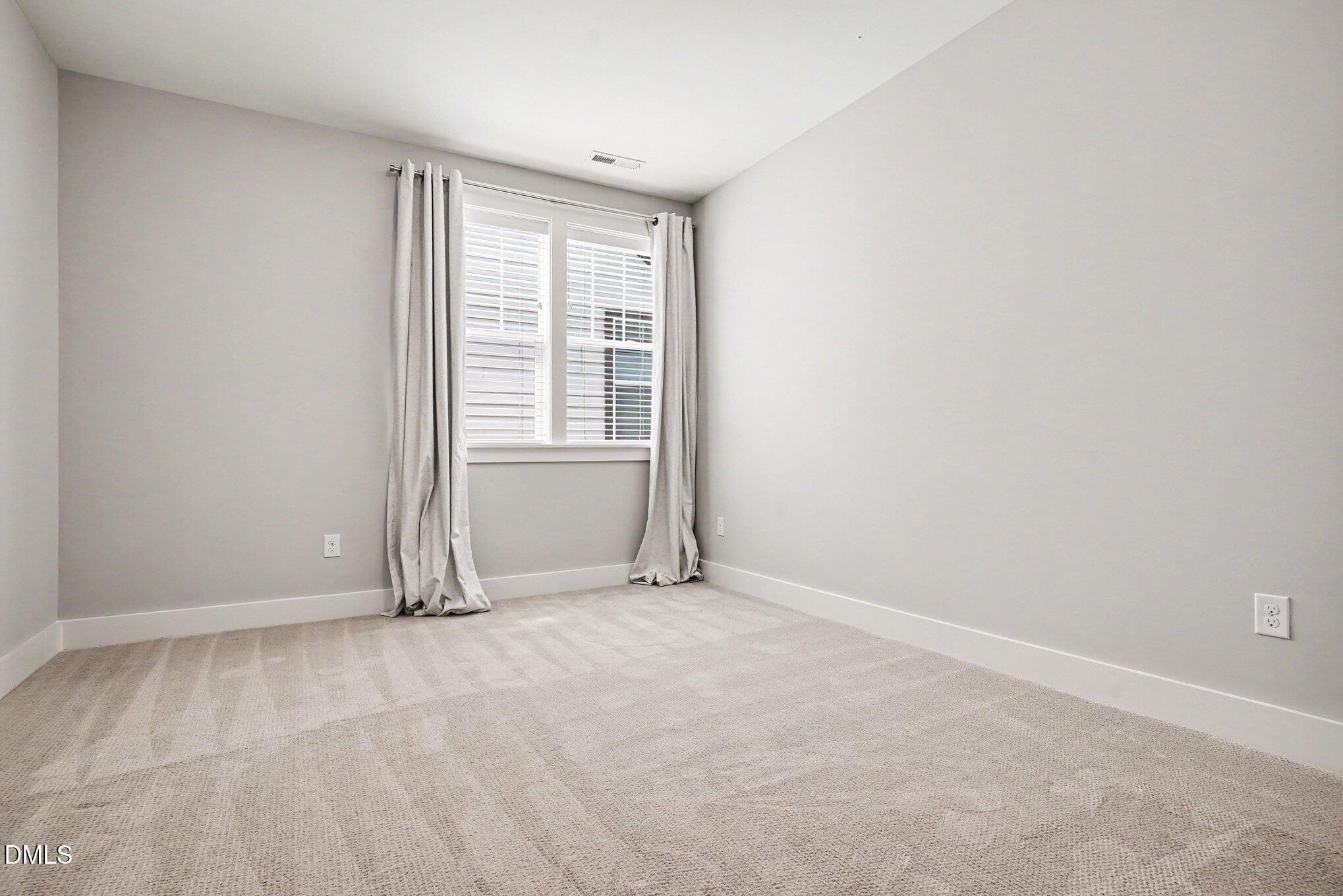 824 Watercolor Way Durham, NC 27713 - Photo 19 of 28 an empty room with a empty space and a window