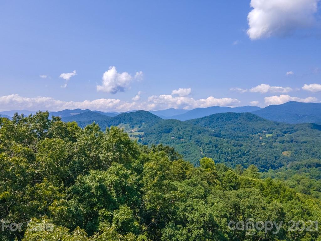9 Walnut Ridge Drive Clyde, NC 28721 - Photo 1 of 41 a view of a city and mountain view