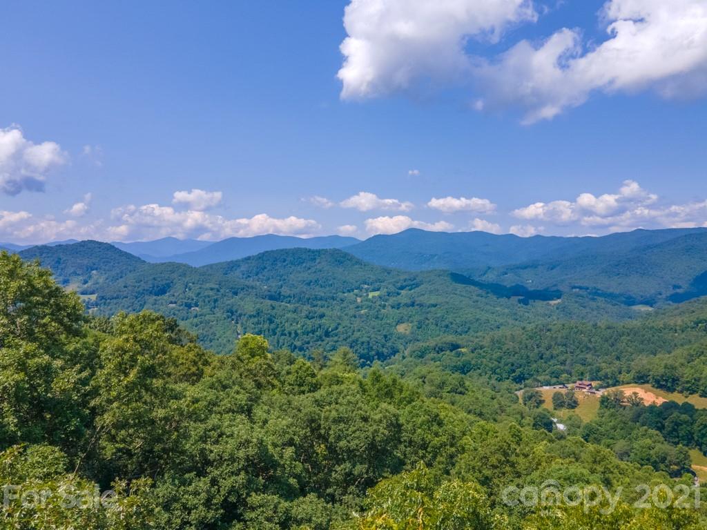 9 Walnut Ridge Drive Clyde, NC 28721 - Photo 3 of 41 a view of a city and mountains in the background