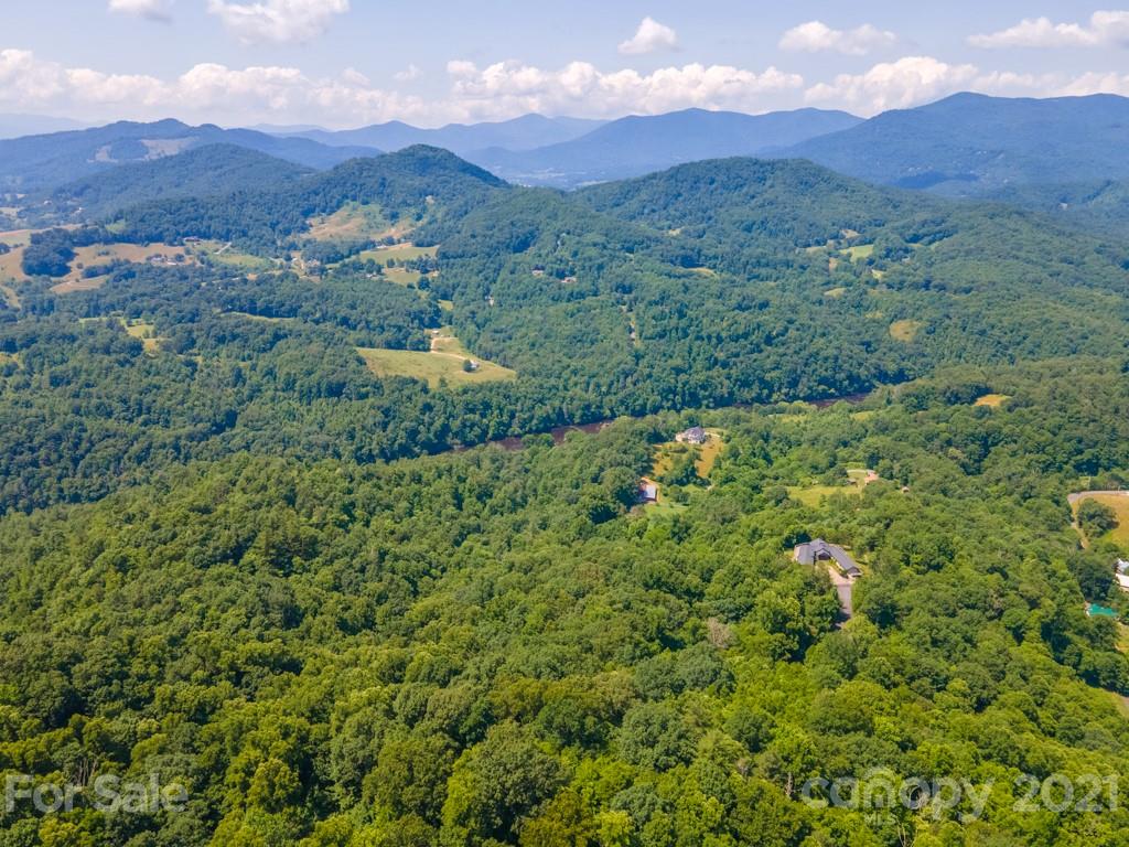 9 Walnut Ridge Drive Clyde, NC 28721 - Photo 4 of 41 a view of a lush green hillside and houses
