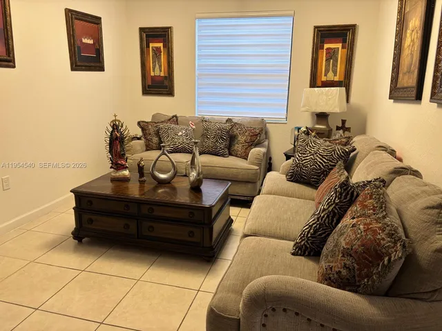 a living room with furniture and a couch