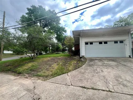 a backyard of a house with a yard and garage