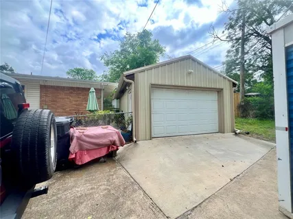 a backyard of a house with yard fire pit and outdoor seating