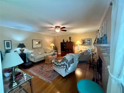 a living room with furniture and a lamp