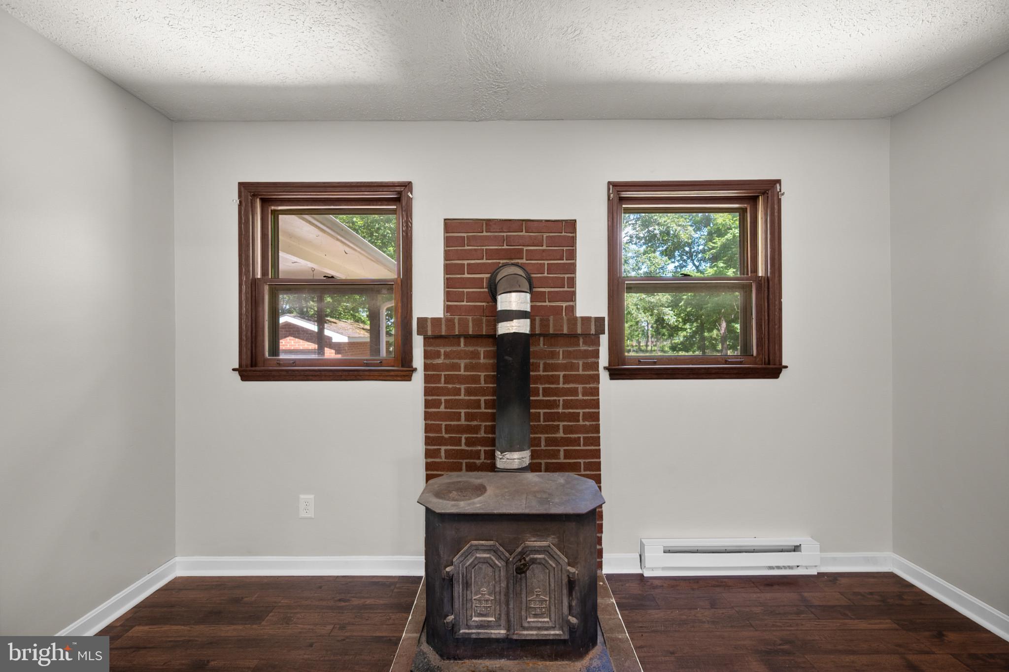 2085 Crums Church Road Berryville, VA 22611 - Photo 19 of 61 Wood stove in office/bedroom/dining room