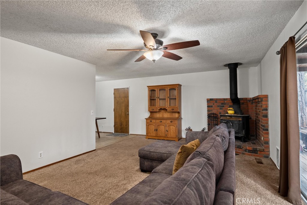 15353 Forest Ranch Way Forest Ranch, CA 95942 - Photo 15 of 47 a living room with furniture and a ceiling fan