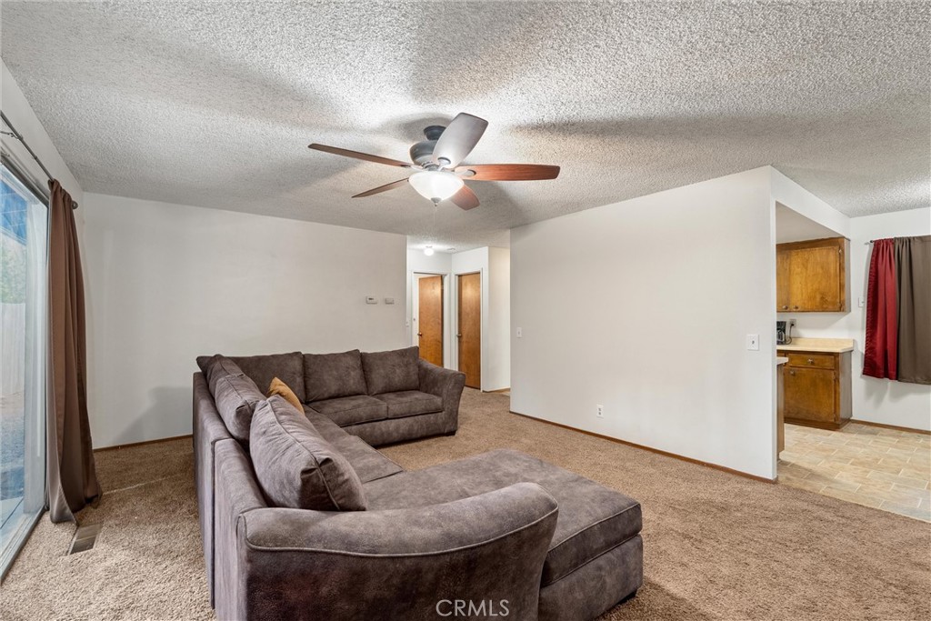 15353 Forest Ranch Way Forest Ranch, CA 95942 - Photo 16 of 47 a living room with furniture and a ceiling fan