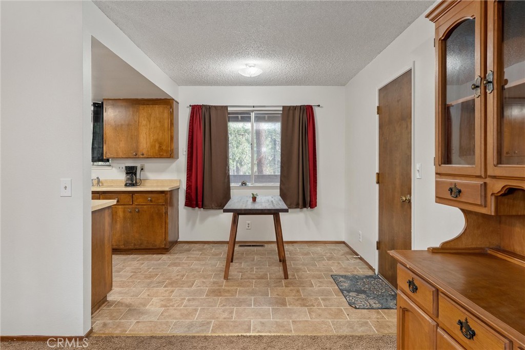 15353 Forest Ranch Way Forest Ranch, CA 95942 - Photo 17 of 47 a hallway with a sink and a stove top oven