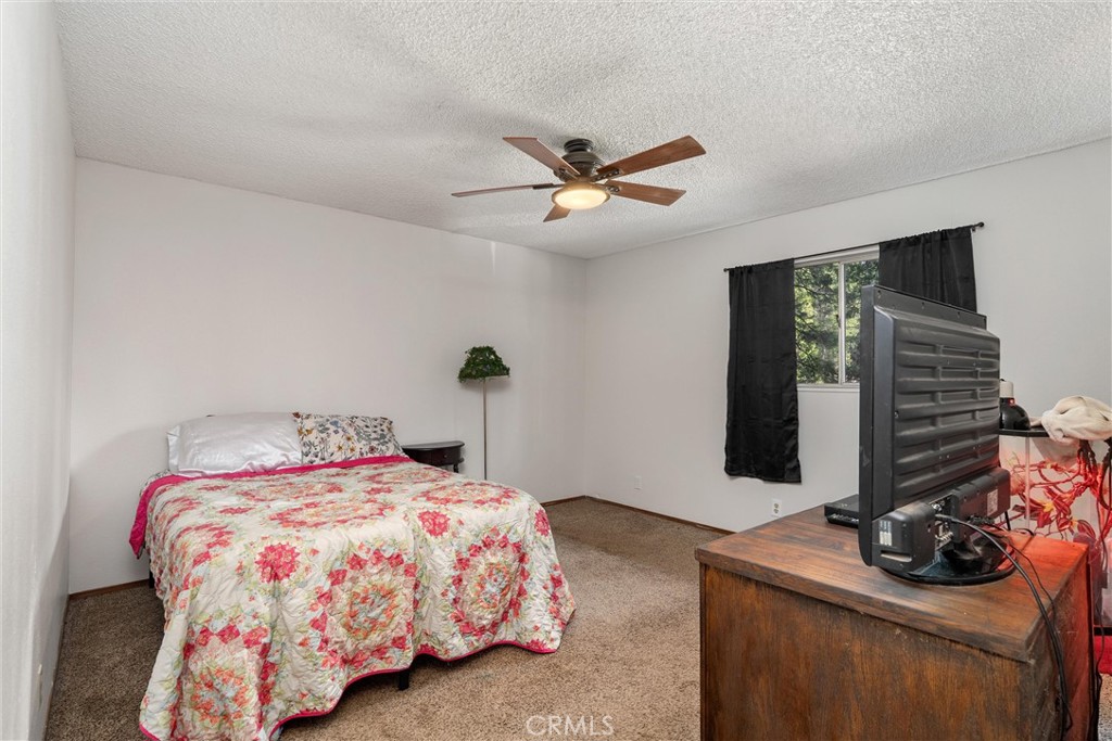 15353 Forest Ranch Way Forest Ranch, CA 95942 - Photo 23 of 47 a bedroom with a bed and a dresser