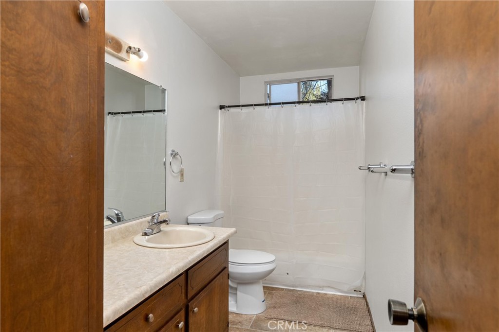 15353 Forest Ranch Way Forest Ranch, CA 95942 - Photo 24 of 47 a bathroom with a sink toilet and a mirror