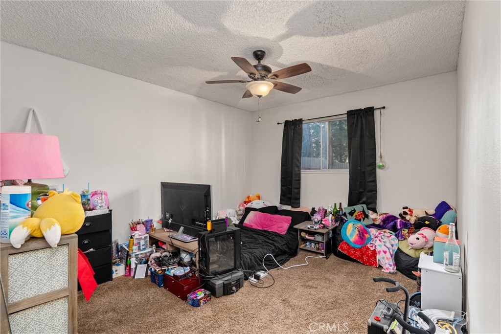 15353 Forest Ranch Way Forest Ranch, CA 95942 - Photo 25 of 47 a bed room with a bed and a window