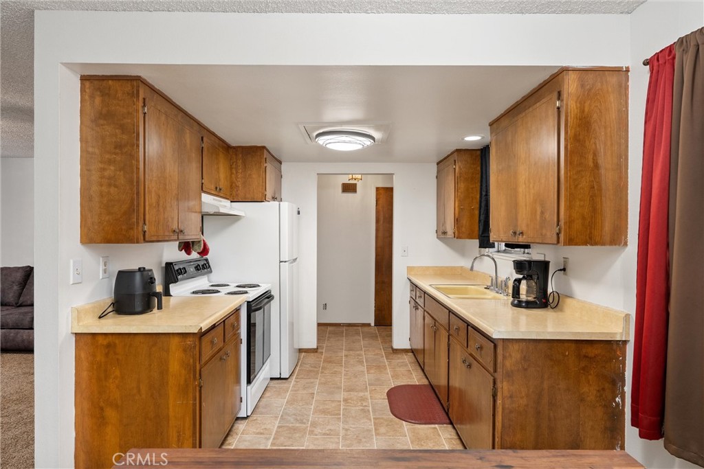 15353 Forest Ranch Way Forest Ranch, CA 95942 - Photo 3 of 47 a kitchen with stainless steel appliances granite countertop a sink stove and cabinets