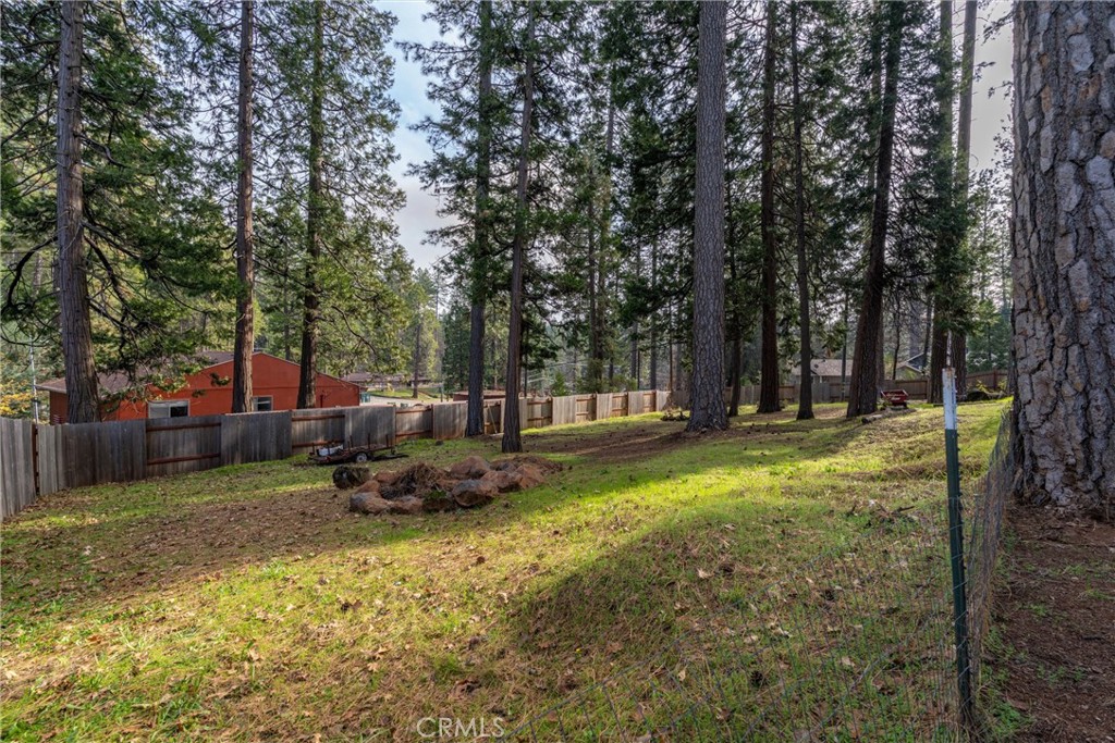 15353 Forest Ranch Way Forest Ranch, CA 95942 - Photo 37 of 47 a backyard of a house with table and chairs