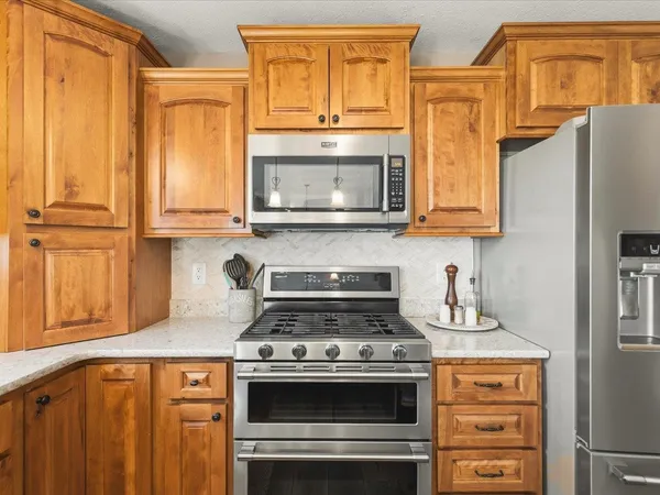 a bathroom with a granite countertop sink mirror and vanity