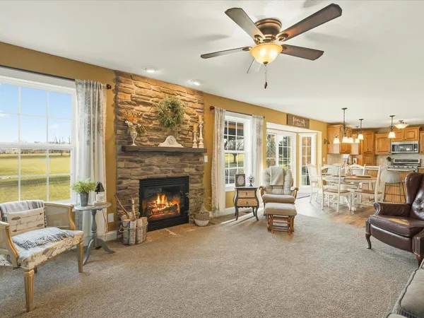 a bathroom with a granite countertop toilet sink and mirror