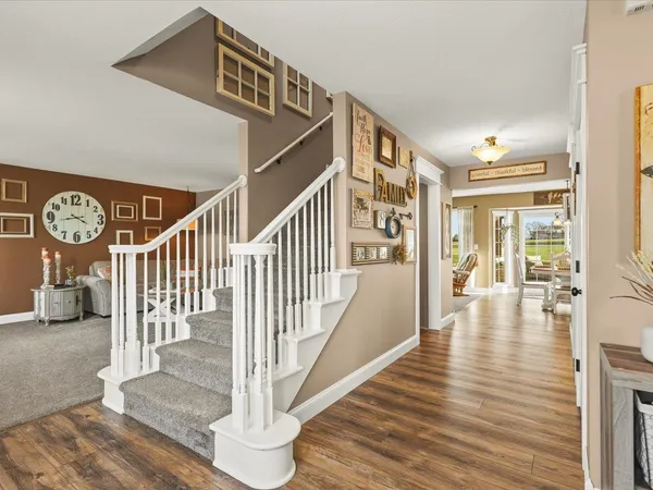 a view of a livingroom with furniture and a window