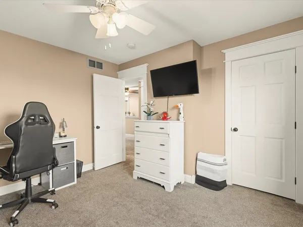 a bedroom with a bed and window