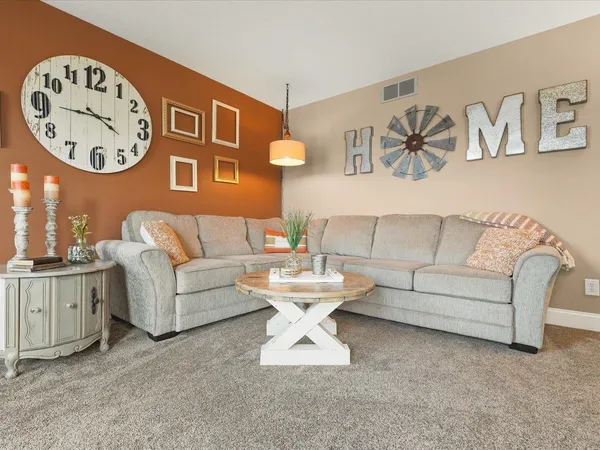 a view of a dining room with furniture wooden floor and chandelier