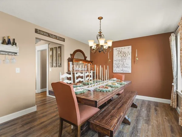 a living room with dining table and chairs