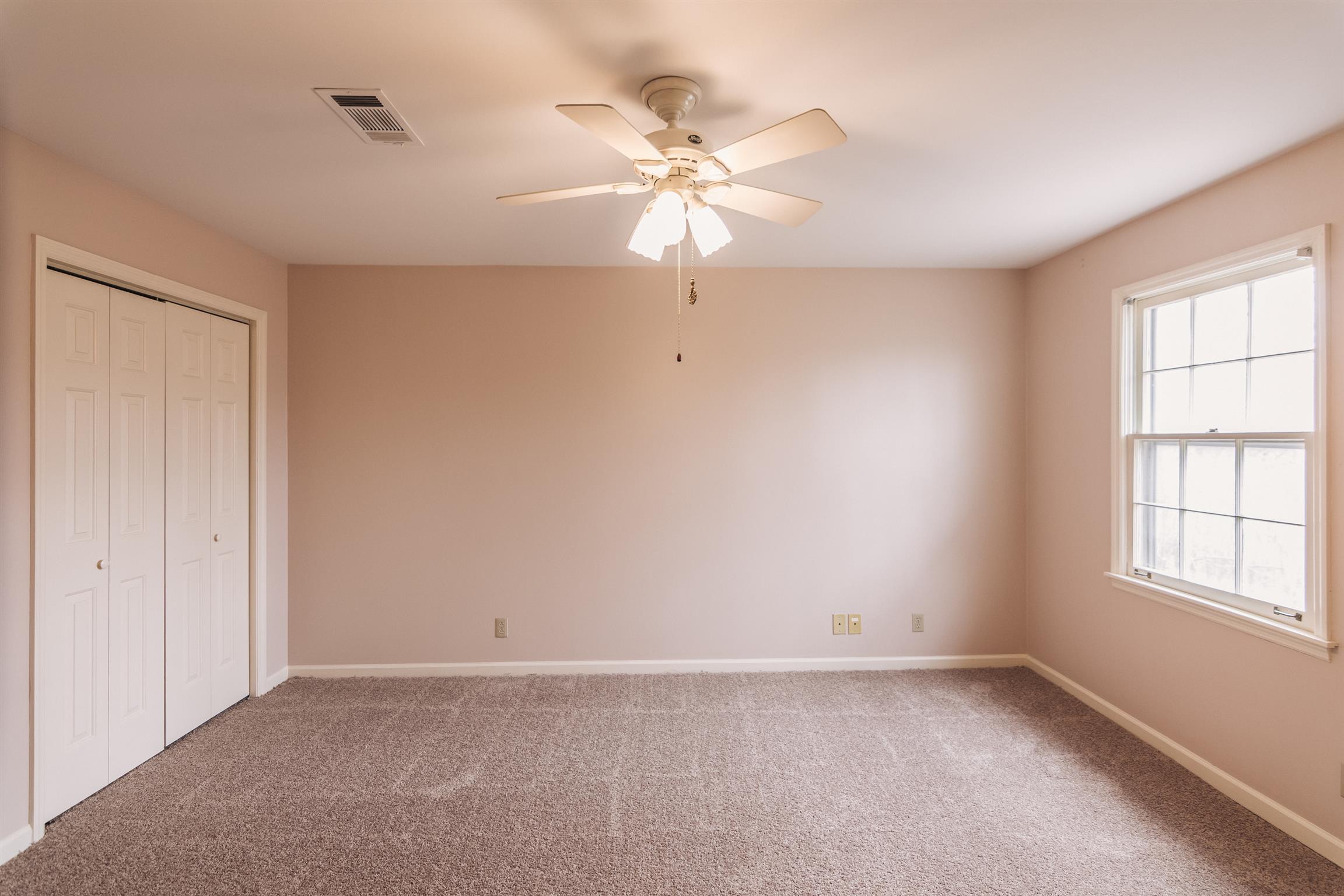 2329 Rader Ridge Road Antioch, TN 37013 - Photo 14 of 20 an empty room with windows and fan