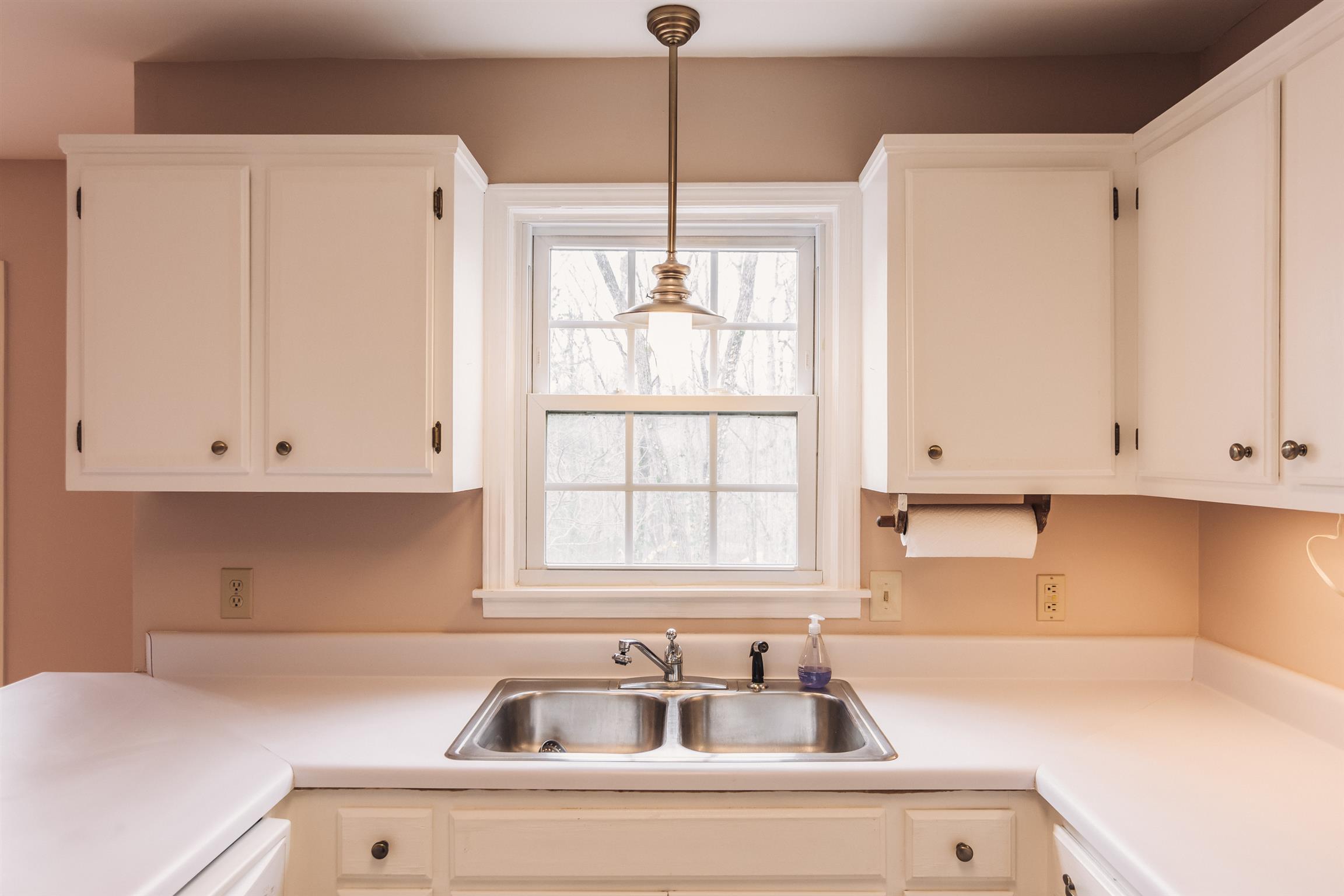 2329 Rader Ridge Road Antioch, TN 37013 - Photo 9 of 20 a kitchen with a sink cabinets and window