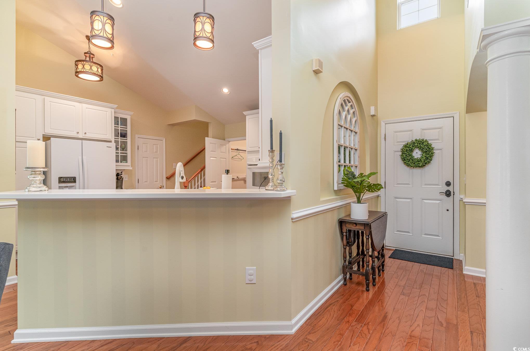 3533 Arrowhead Boulevard Myrtle Beach, SC 29579 - Photo 4 of 31 Kitchen with white cabinetry, pendant lighting, li