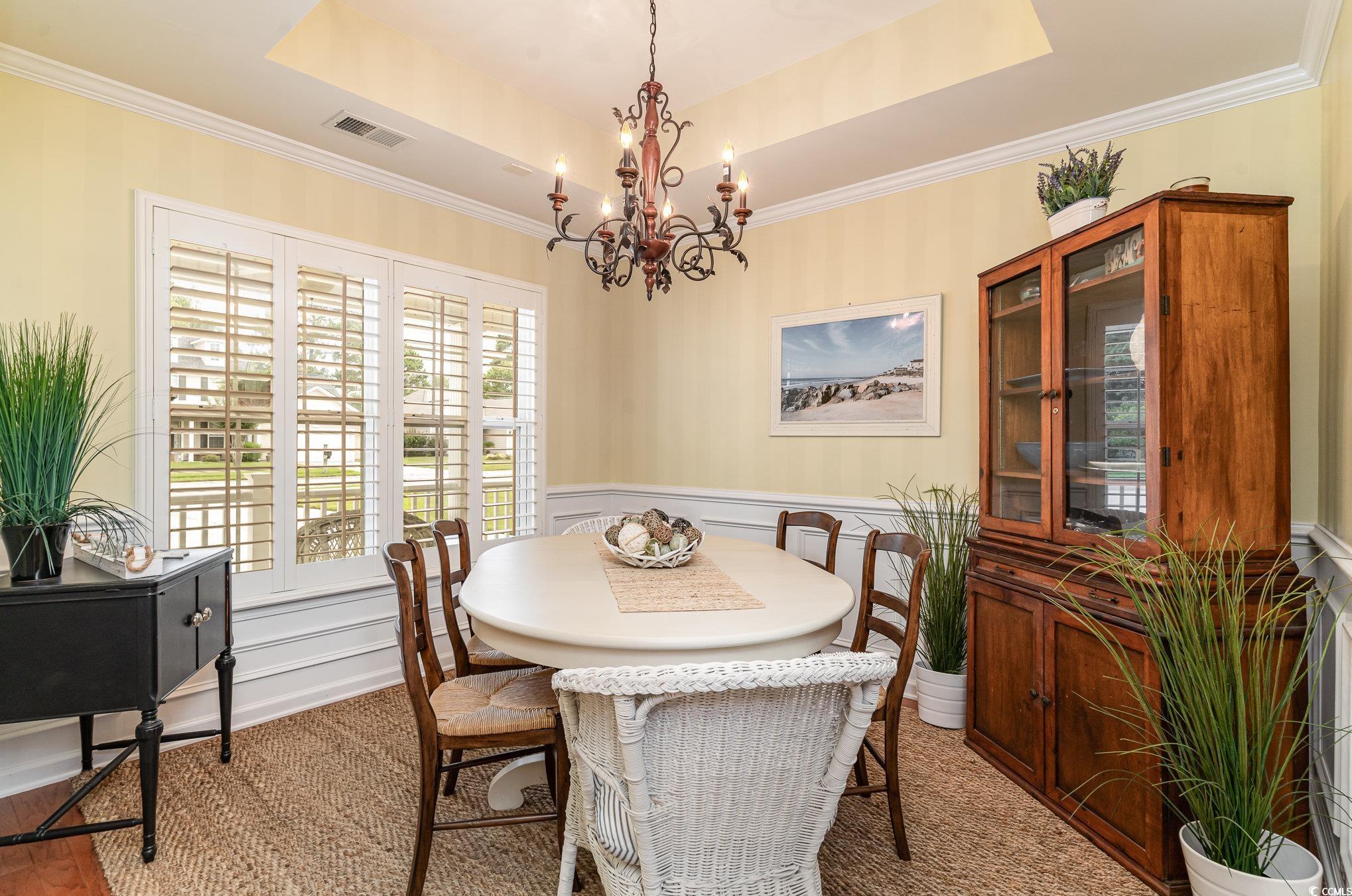 3533 Arrowhead Boulevard Myrtle Beach, SC 29579 - Photo 5 of 31 Dining area featuring ornamental molding, a raised