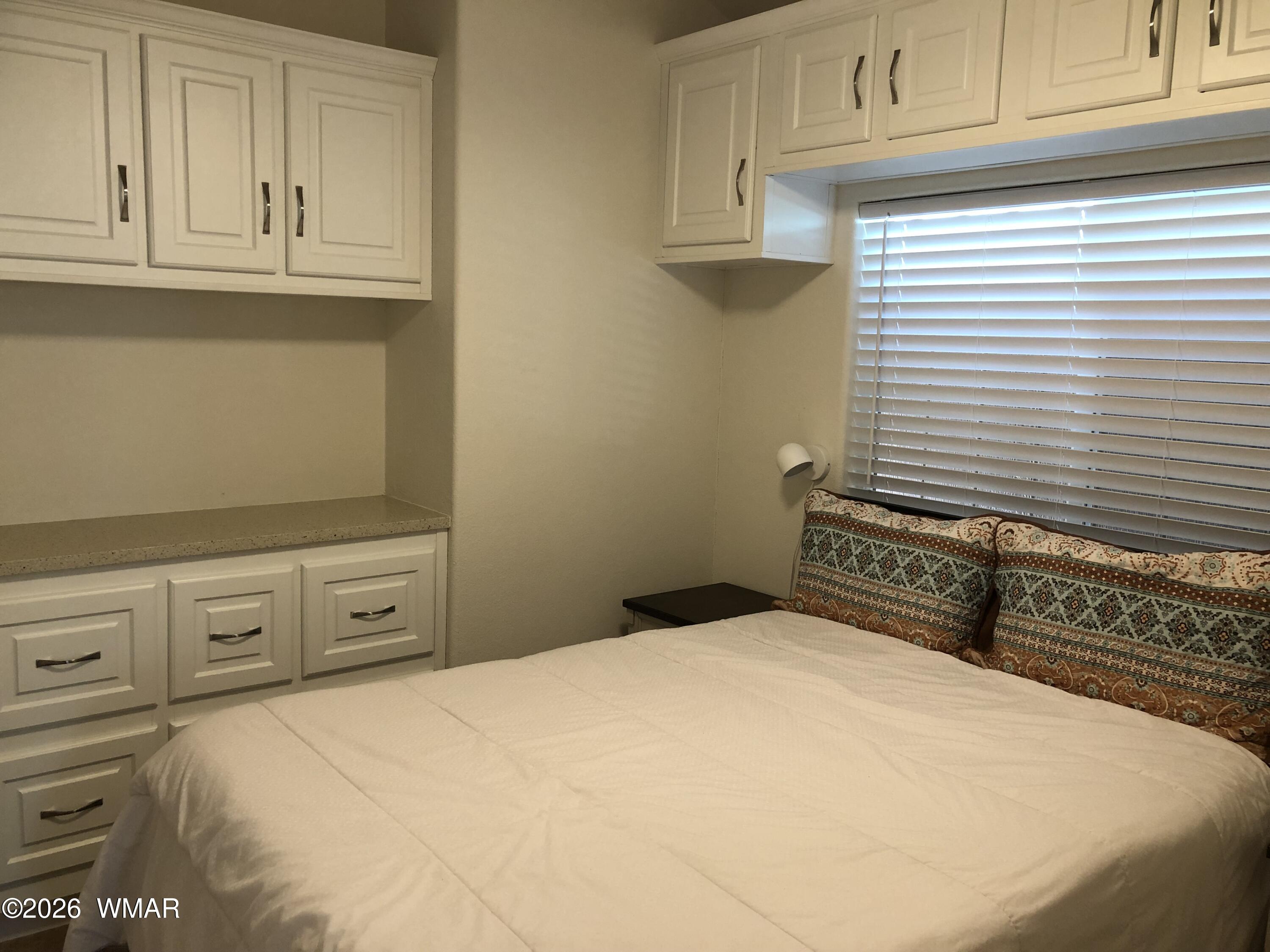 2301 Turtle Creek Road Show Low, AZ 85901 - Photo 21 of 35 a bedroom with a bed and cabinets