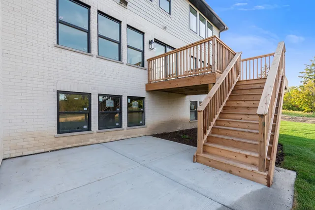 front view of a house with a large window