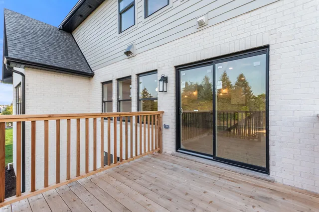 a view of a brick house with a large window