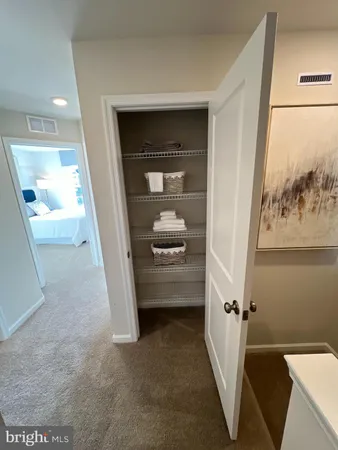 a view of a hallway with a couch