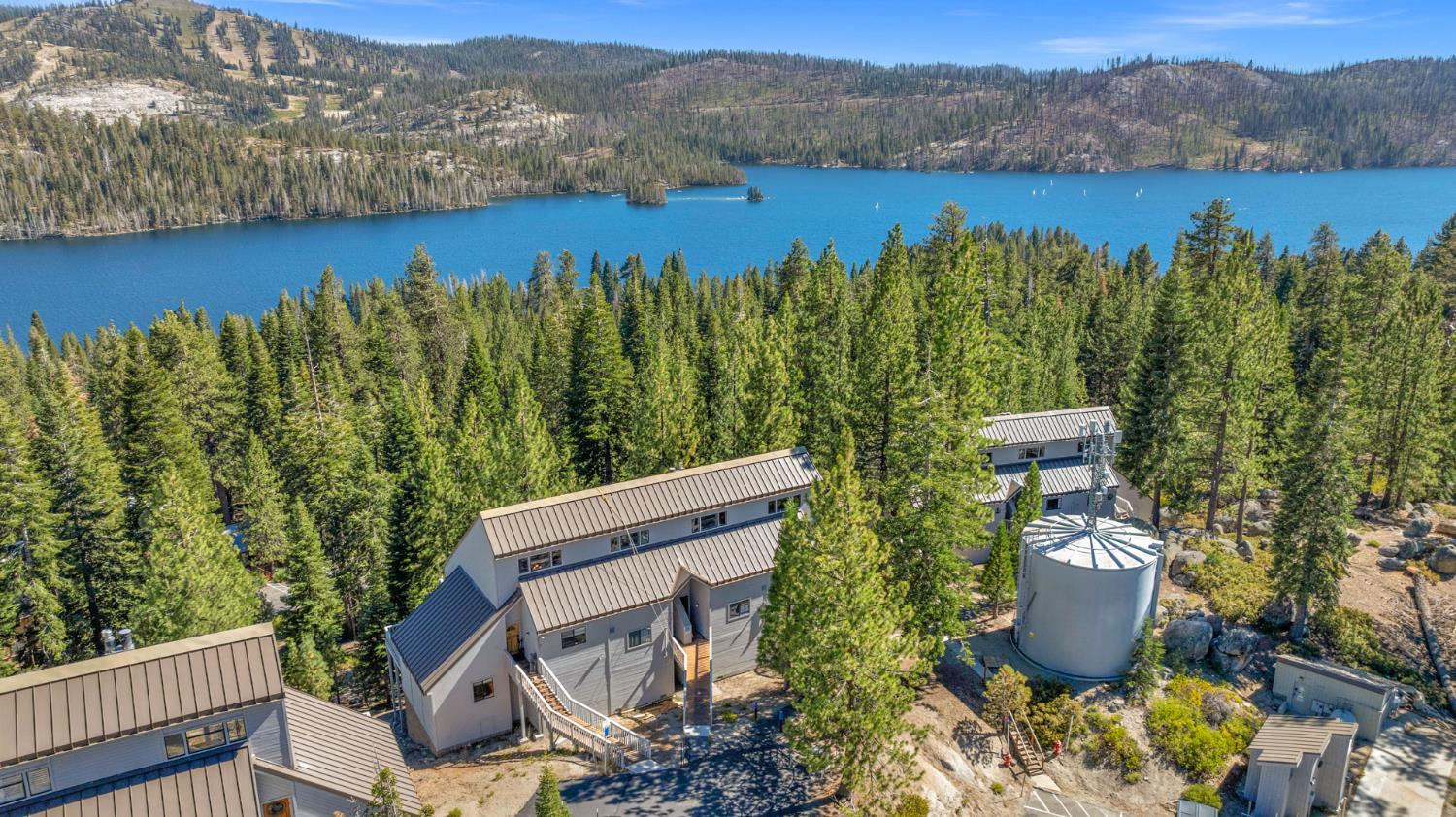 a view of a swimming pool with lake and mountain view