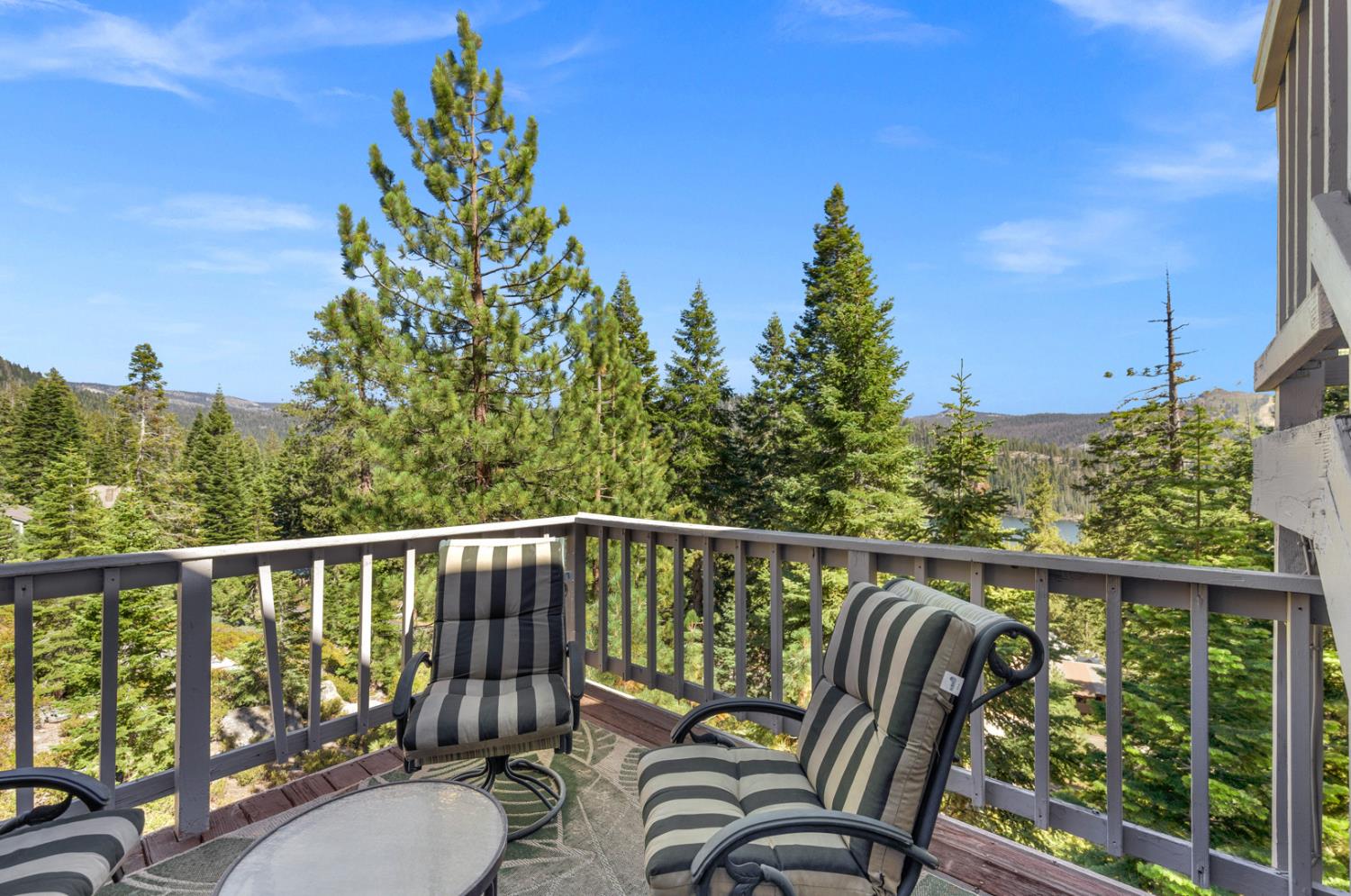 63217 Huntington Vista Road, Unit 81 Mono Hot Springs, CA 93642 - Photo 11 of 53 a balcony with wooden floor and outdoor seating