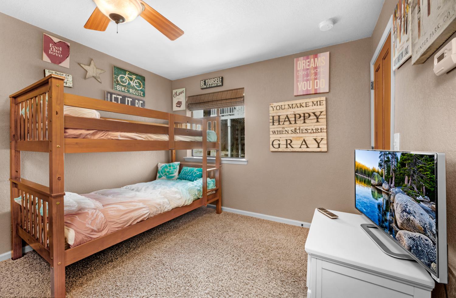 63217 Huntington Vista Road, Unit 81 Mono Hot Springs, CA 93642 - Photo 22 of 53 a bedroom with a bed and a flat tv screen on the dresser