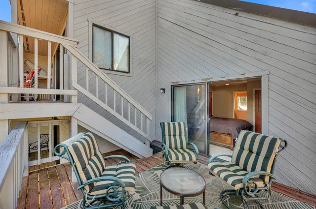 a view of a balcony with furniture