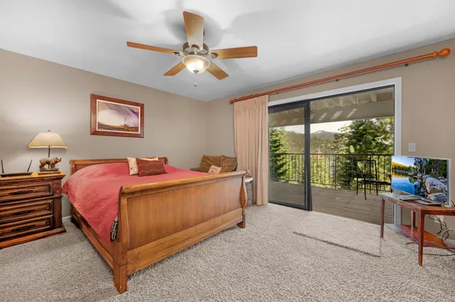 a bed room with a bed and a chandelier