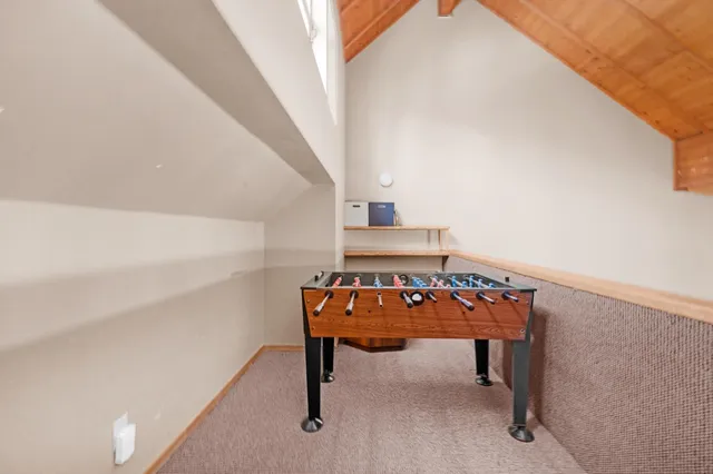 a view of a chairs and table in the balcony