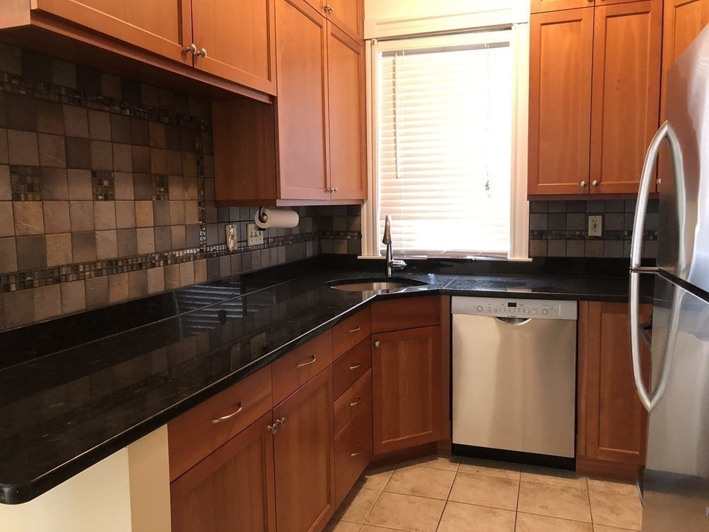 96 St Paul Street, Unit 2 Brookline, MA 02446 - Photo 5 of 14 a kitchen with a sink and cabinets