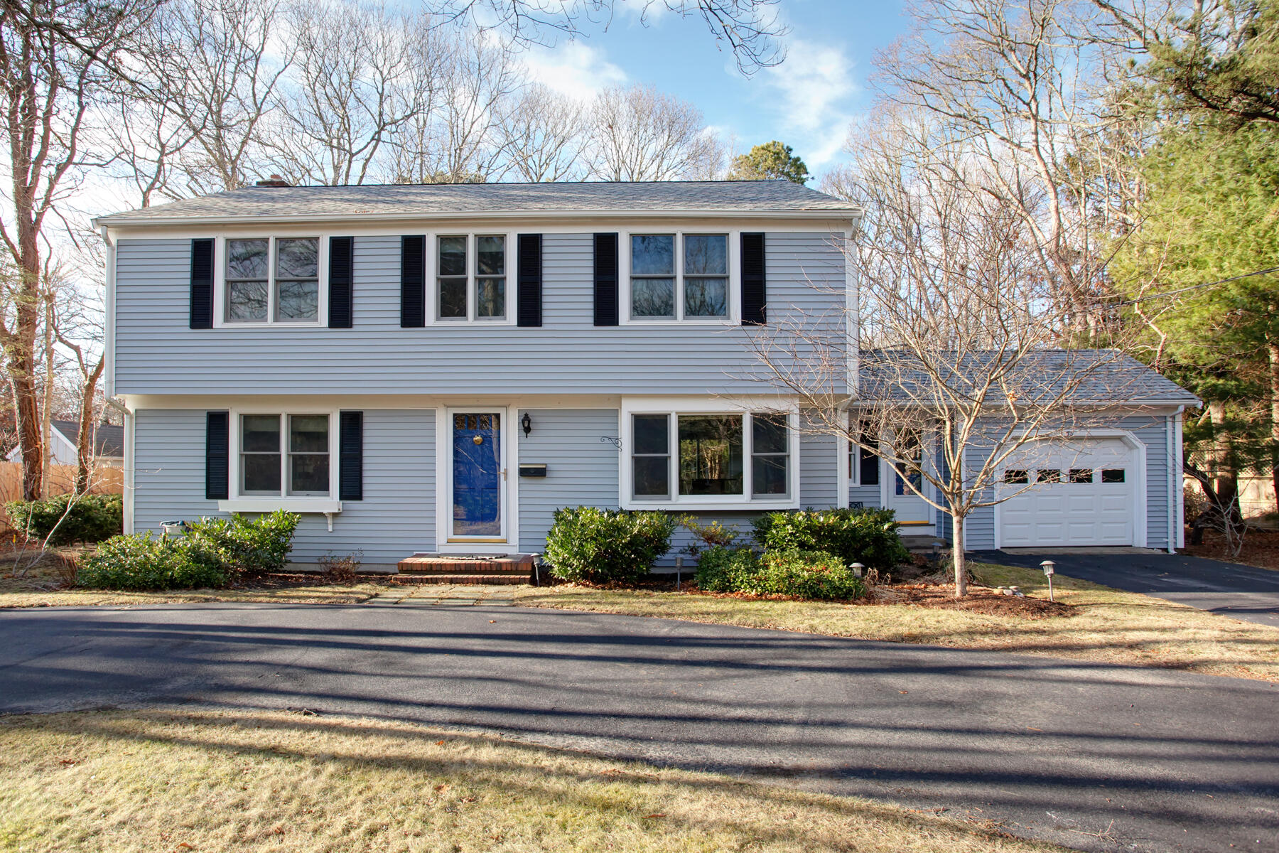 36 Tuckernuck Road Centerville, MA 02632 - Photo 1 of 45 a front view of a house with a yard