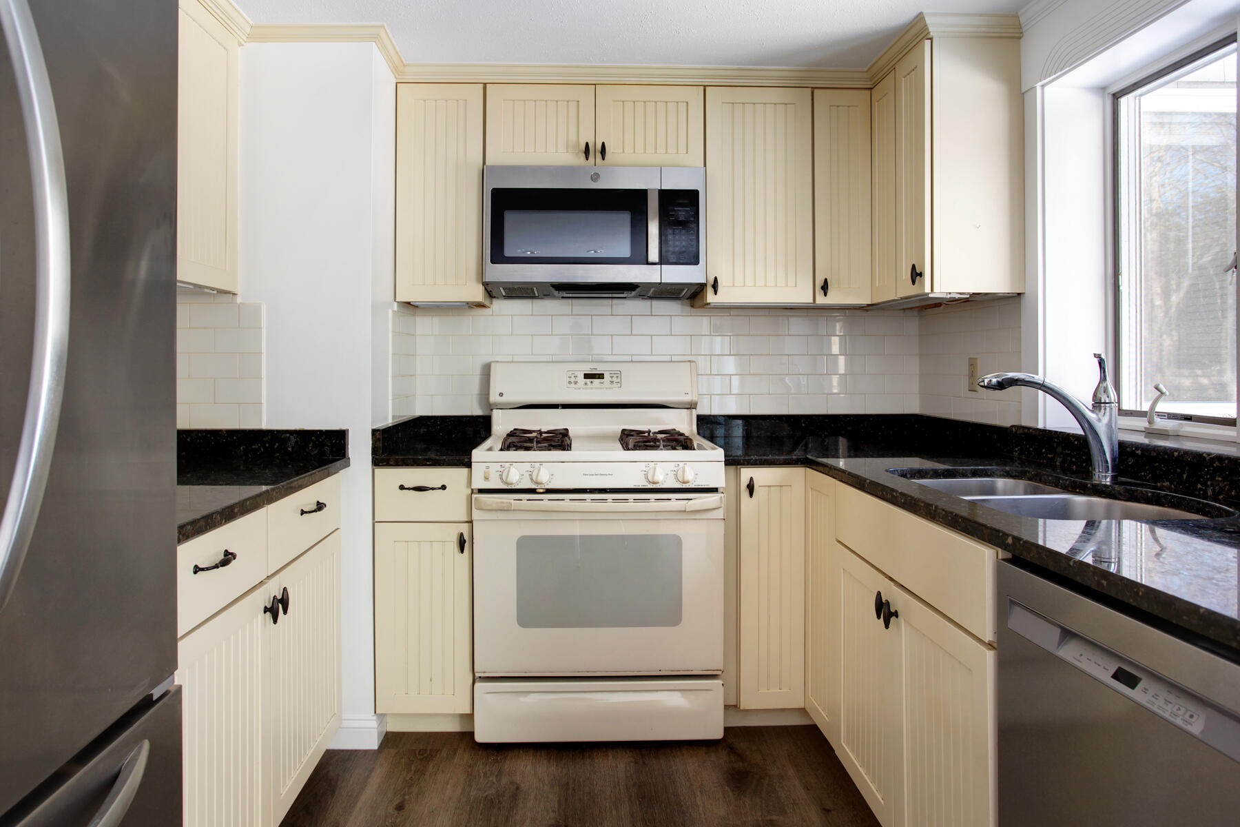 36 Tuckernuck Road Centerville, MA 02632 - Photo 13 of 45 a kitchen with cabinets stainless steel appliances and a sink