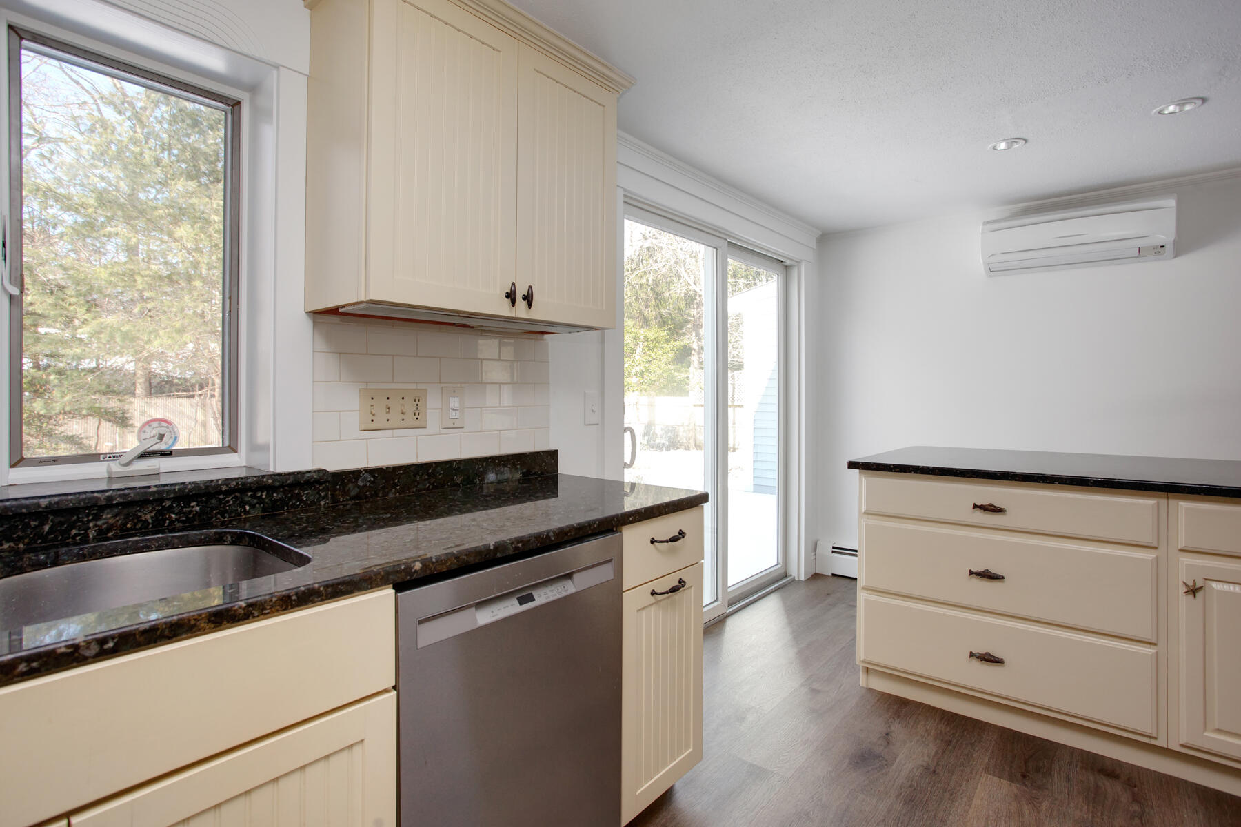 36 Tuckernuck Road Centerville, MA 02632 - Photo 14 of 45 a kitchen with granite countertop white cabinets and a sink