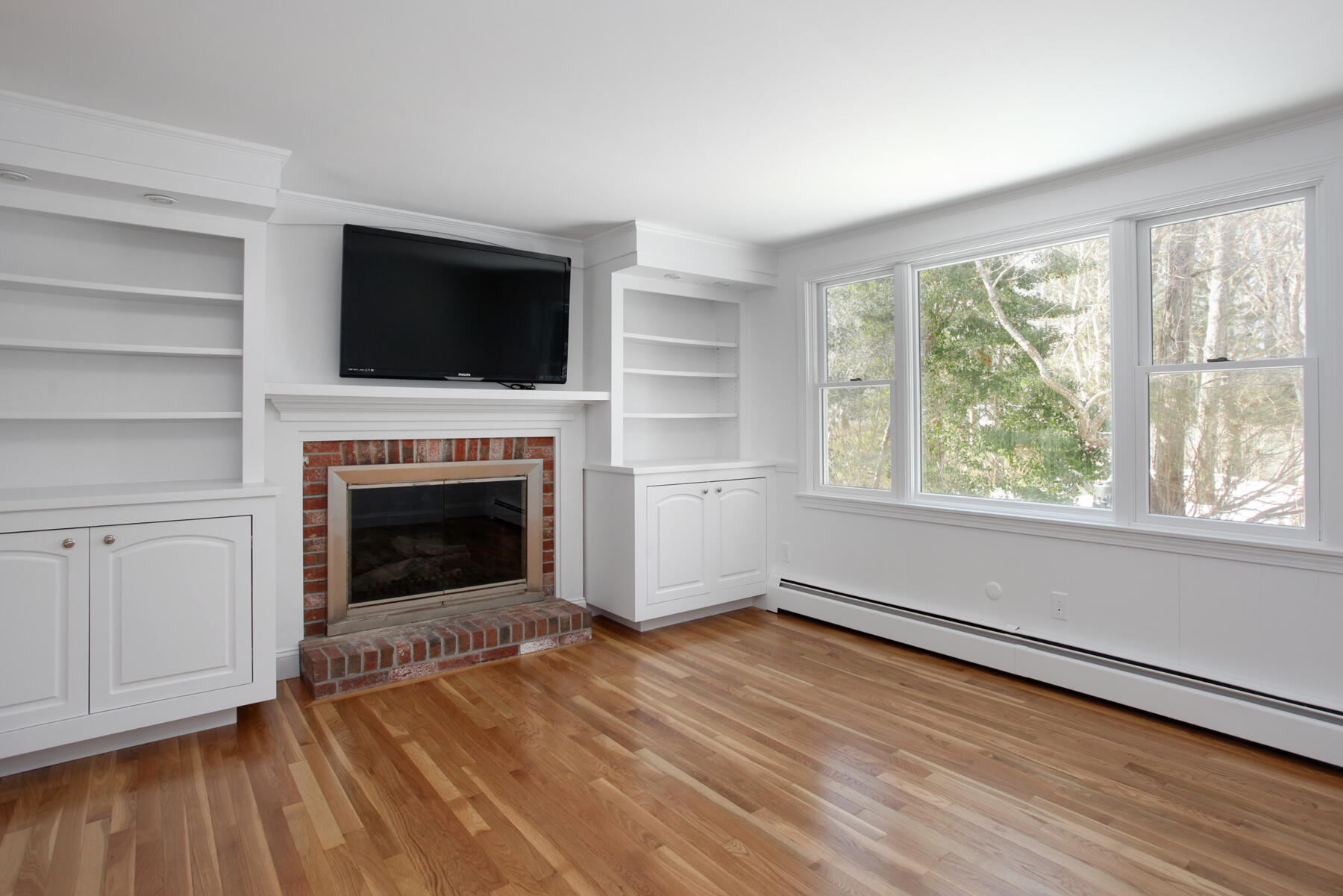 36 Tuckernuck Road Centerville, MA 02632 - Photo 10 of 45 a view of empty room with wooden floor and fireplace