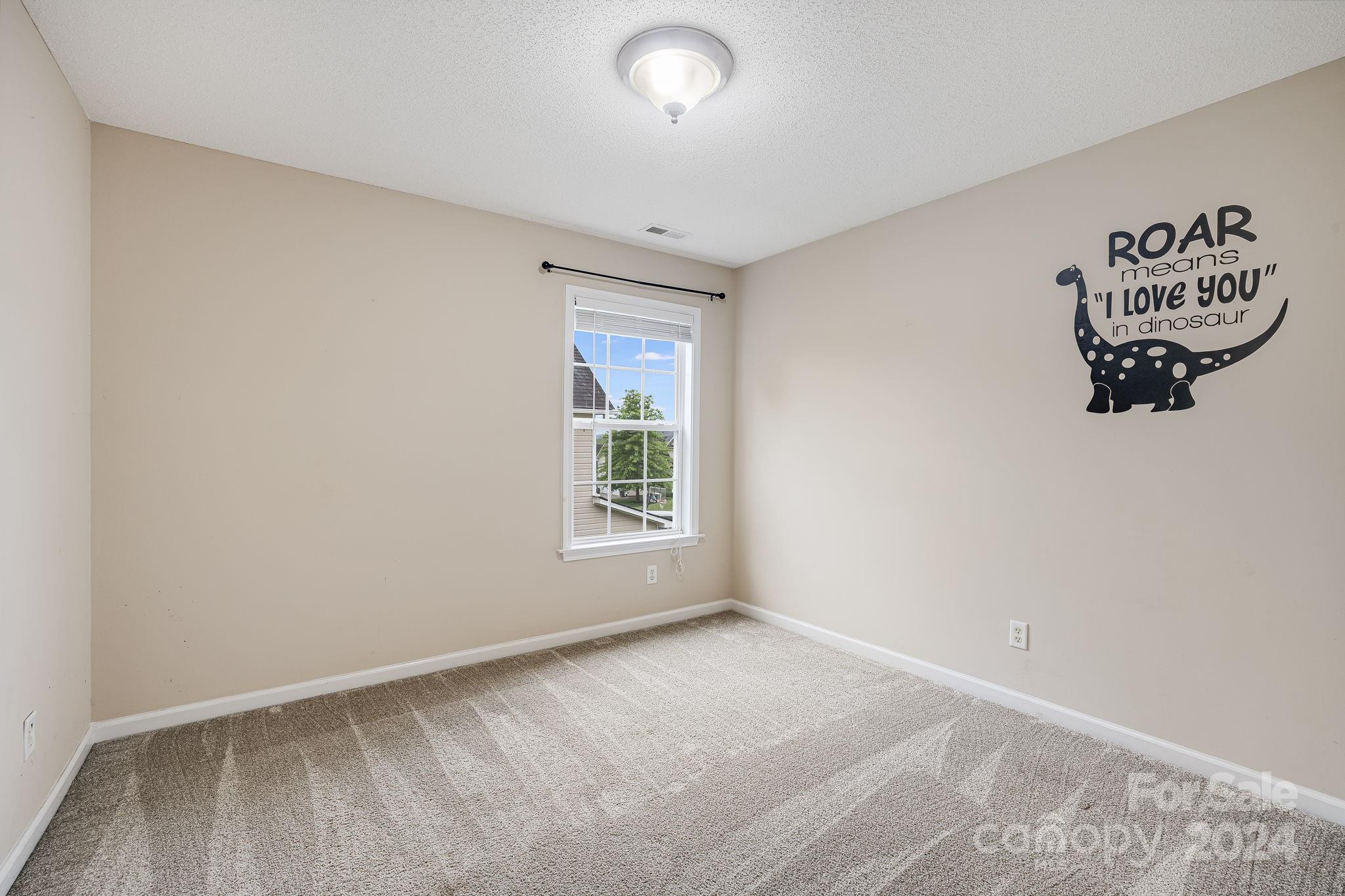 59 Yadkin Road Fletcher, NC 28732 - Photo 14 of 35 an empty room with a window