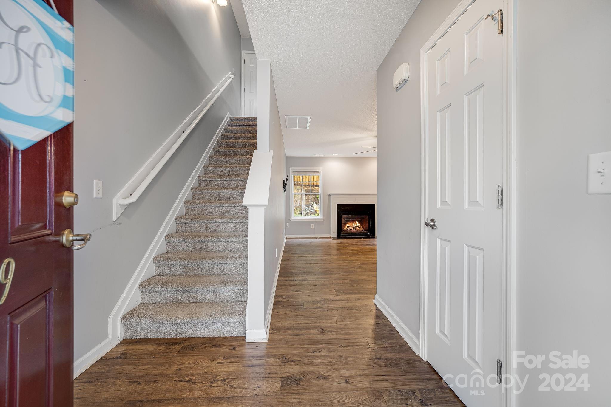 59 Yadkin Road Fletcher, NC 28732 - Photo 3 of 35 a view of entryway and hall with wooden floor