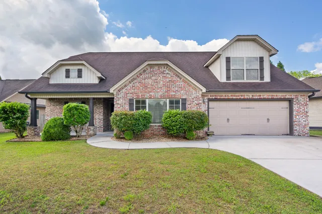 front view of a house with a yard